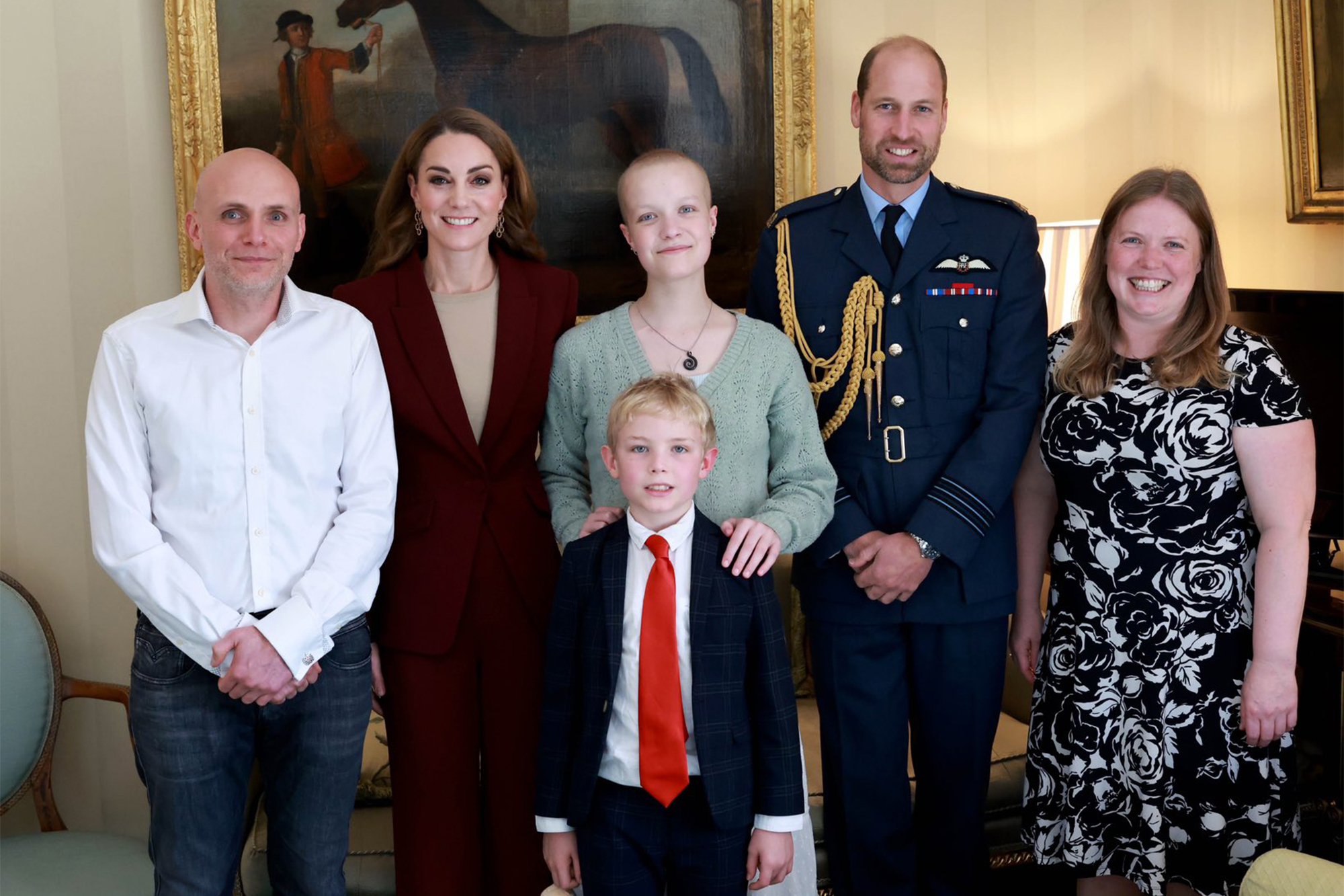 Kate Middleton and Prince William pose with Liz Hatton (center) and her family at Windsor Castle on Oct. 2, 2024.