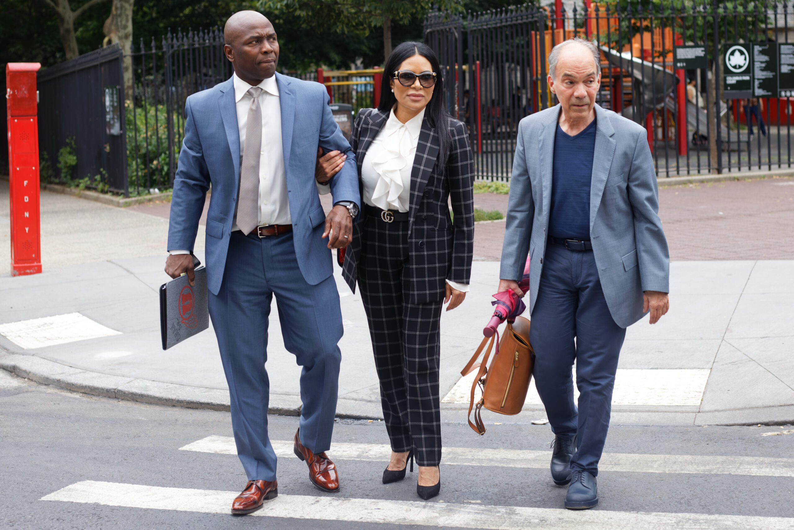 Sharrieff Shah and Jen Shah arriving to court in July 2022