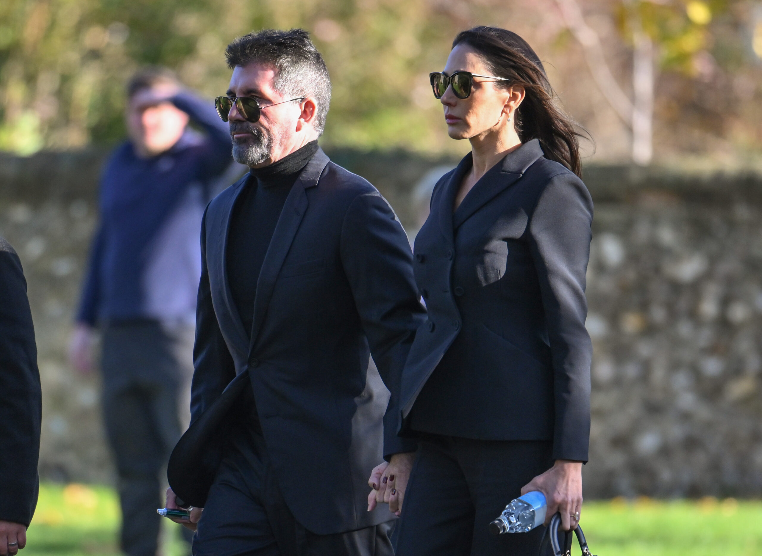 Simon Cowell and Lauren Silverman holding hands