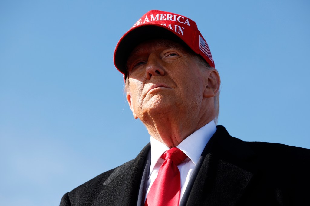 Donald trump wearing a MAGA hat