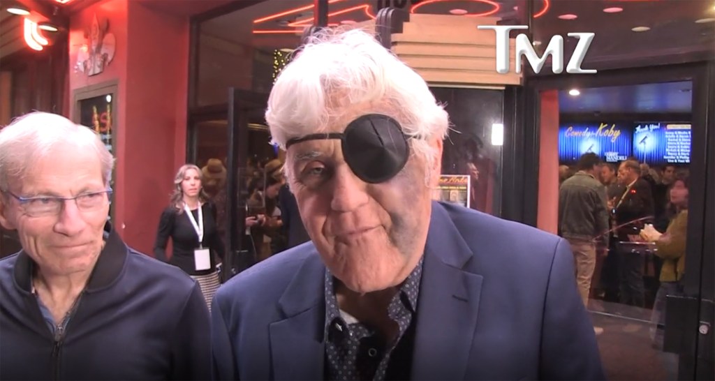 Jay Leno wearing an eyepatch with a bruise on his face.