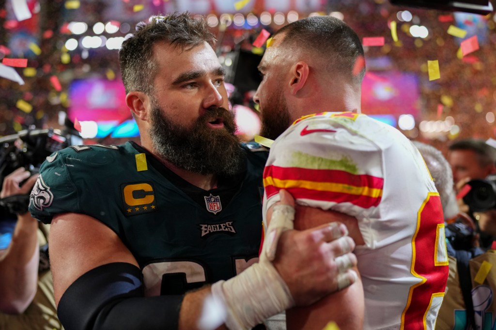 Jason Kelce #62 of the Philadelphia Eagles speaks with Travis Kelce #87 of the Kansas City Chiefs after Super Bowl LVII at State Farm Stadium on February 12, 2023 in Glendale, Arizona.