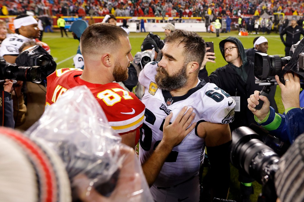 Jason Kelce #62 of the Philadelphia Eagles talks to brother Travis Kelce #87 of the Kansas City Chiefs after their game at GEHA Field at Arrowhead Stadium on November 20, 2023 in Kansas City, Missouri.