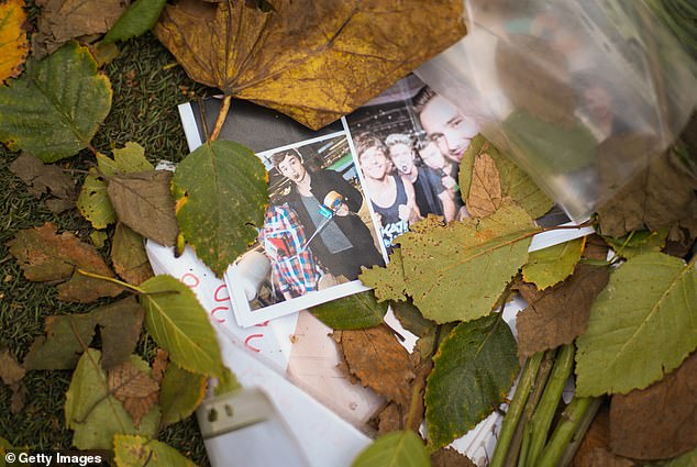 Photos of Mr Payne with his One Direction bandmates were left in tribute in Manchester