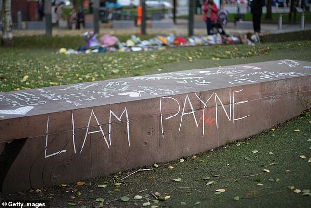 Flowers and tributes for One Direction's Liam Payne are left on a stone plinth at Cathedral Gardens on October 21