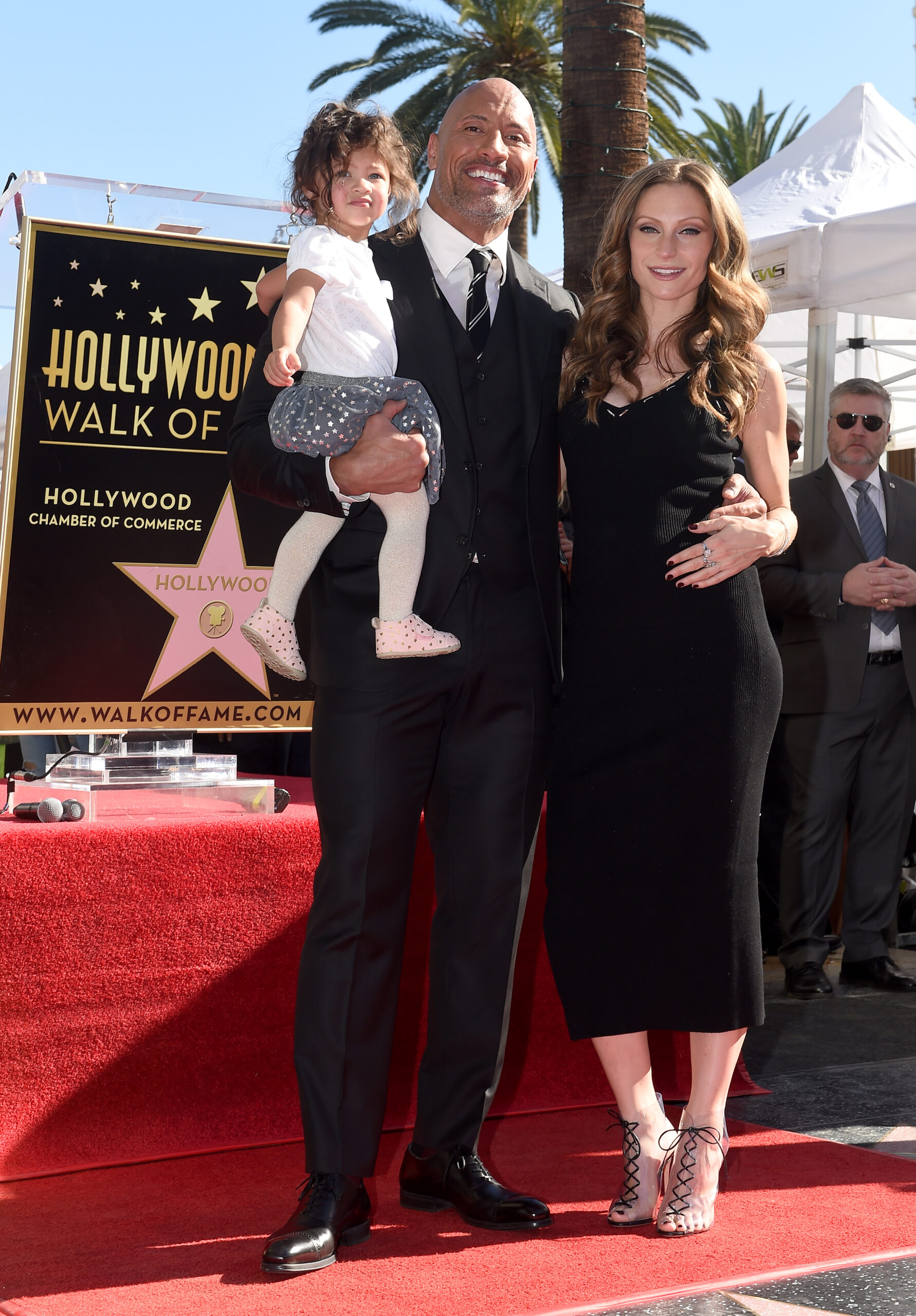 Dwayne "The Rock Johnson, Lauren Hashian and daughter at December 2017 Walk of Fame