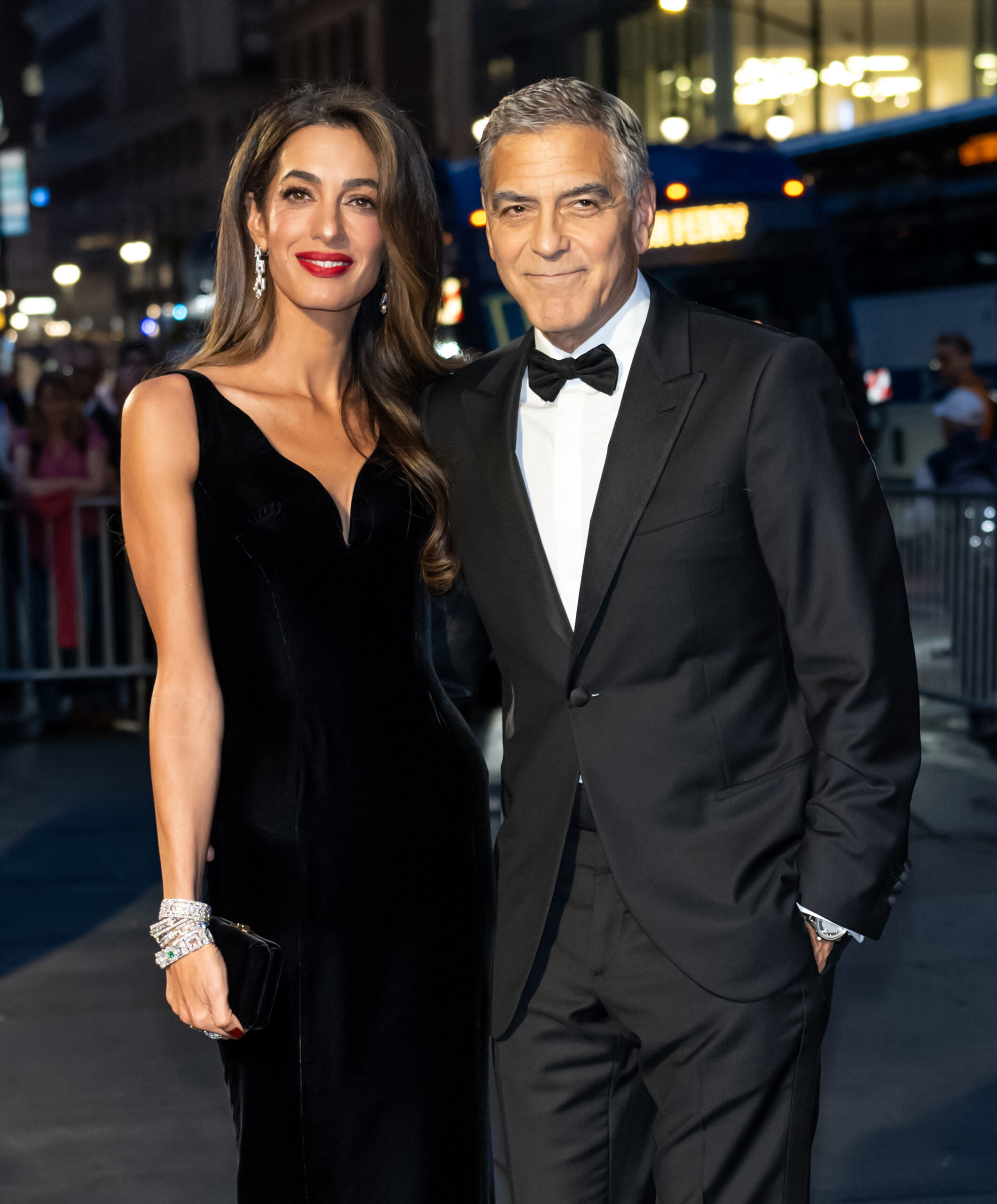 Amal Clooney and George Clooney  posing for a photo