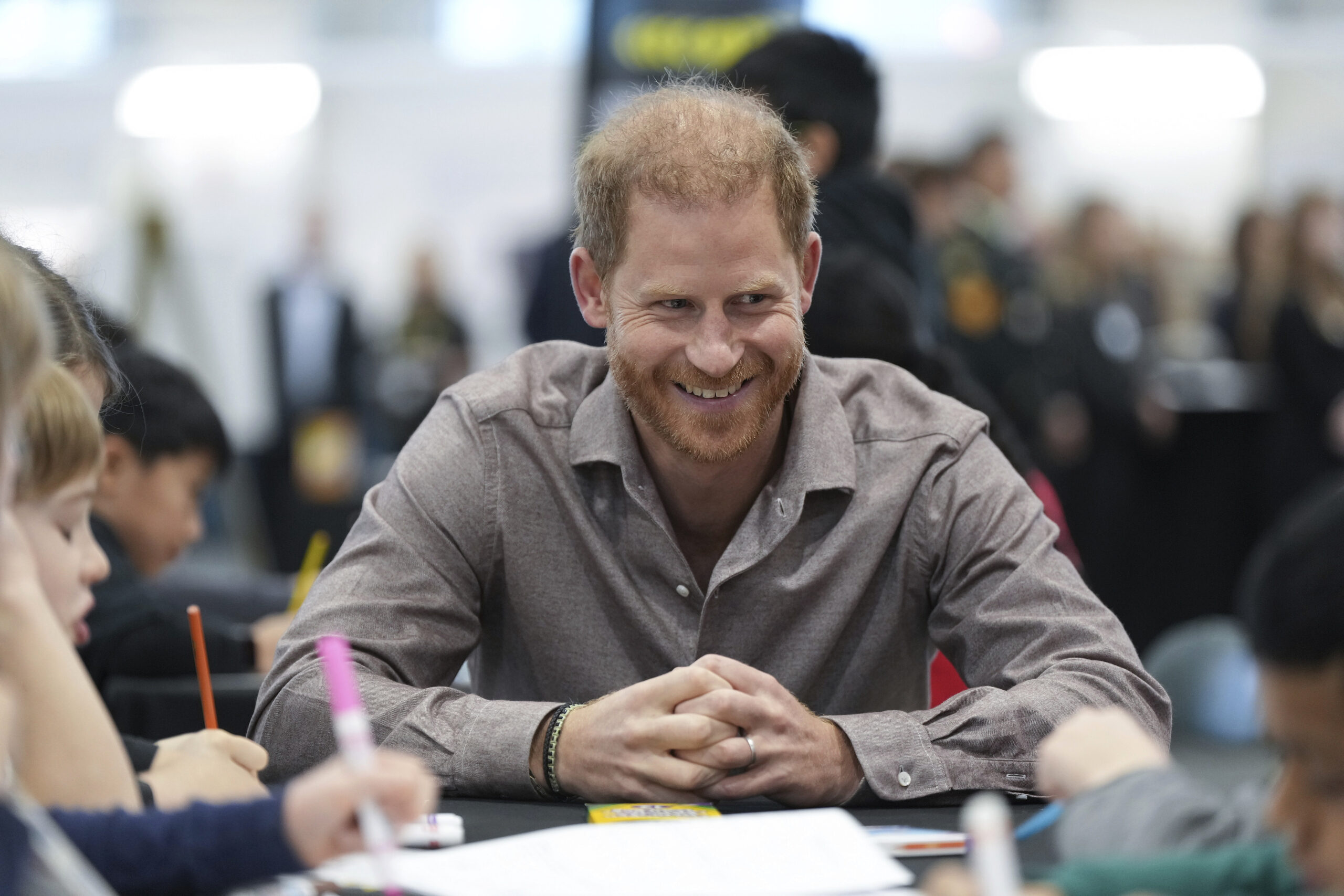 Prince Harry talking to kids at the Invictus Games school program in 2024.