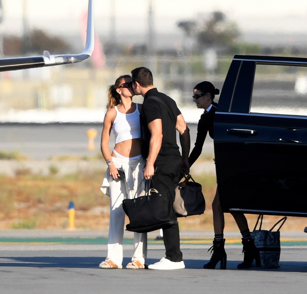 Brooks Nader and Gleb Savchenko pack on the PDA while boarding a private jet in Los Angeles.