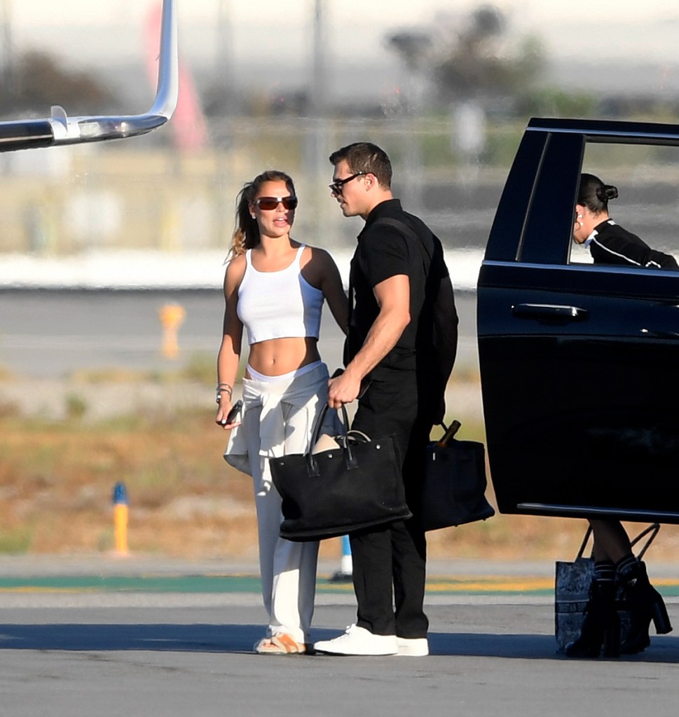 Brooks Nader and Gleb Savchenko pack on the PDA while boarding a private jet in Los Angeles.