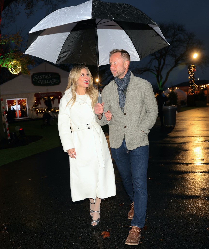 Candace Cameron Bure and her husband on a walk