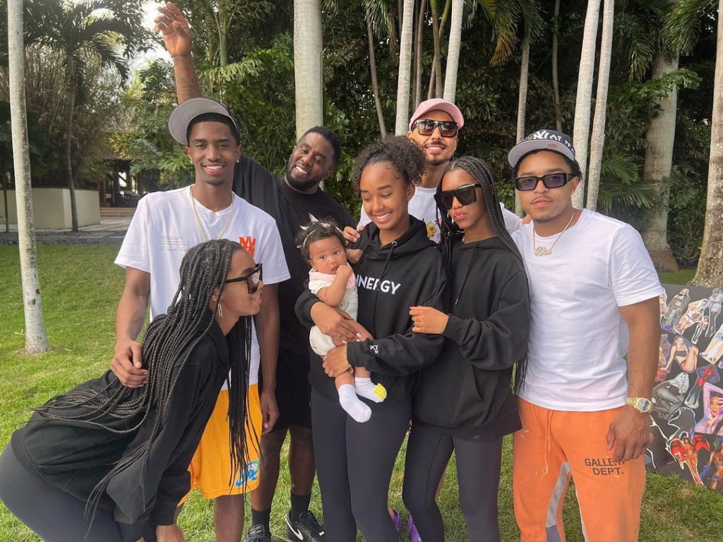 Diddy posing with all seven of his children.