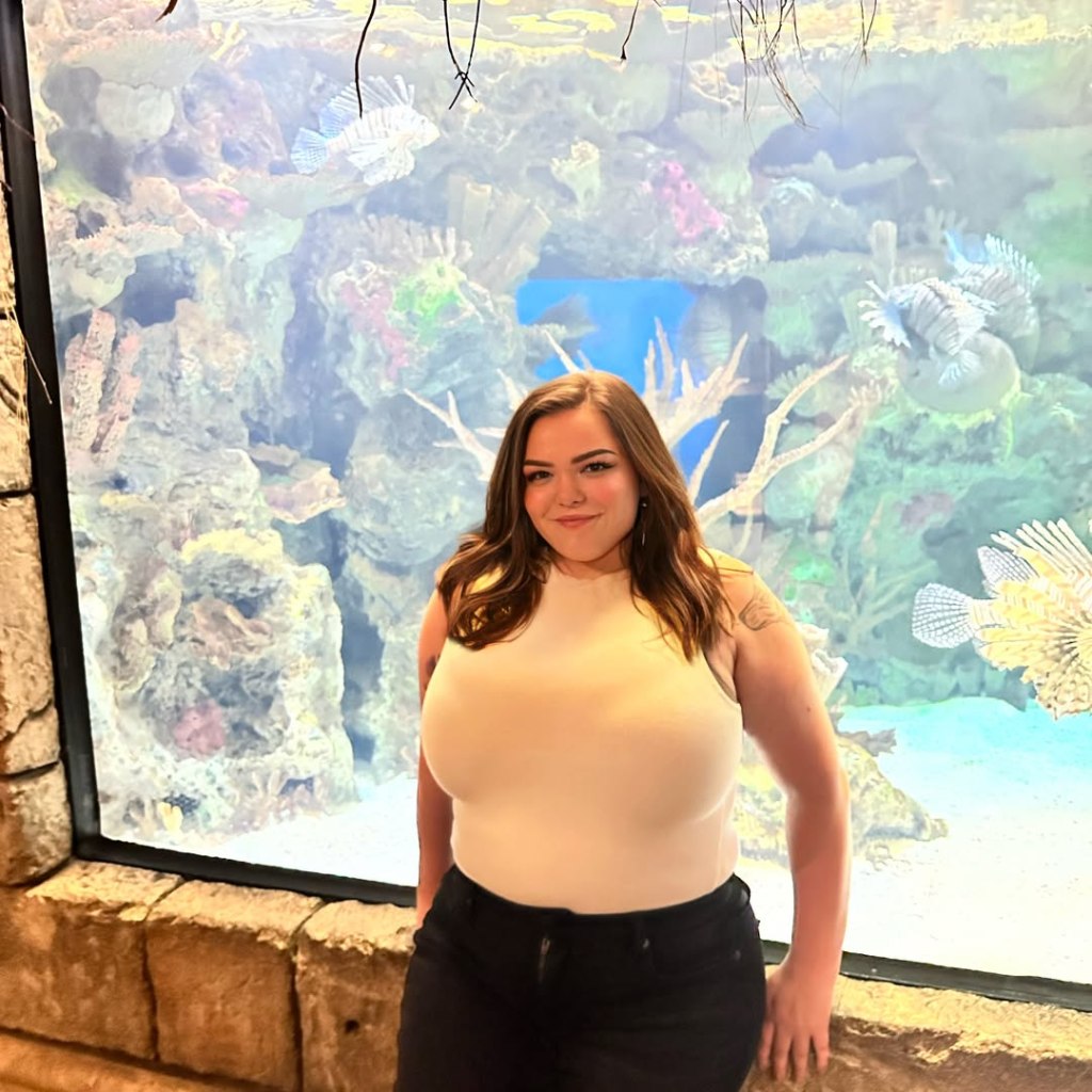 Bonnie Chapman poses at the aquarium.