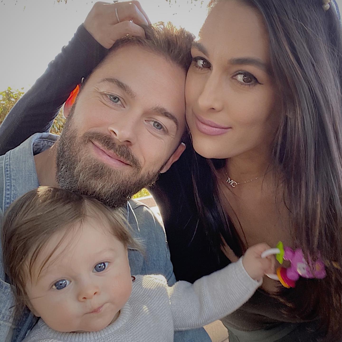 Nikki Garcia and Artem Chigvintsev with their son.