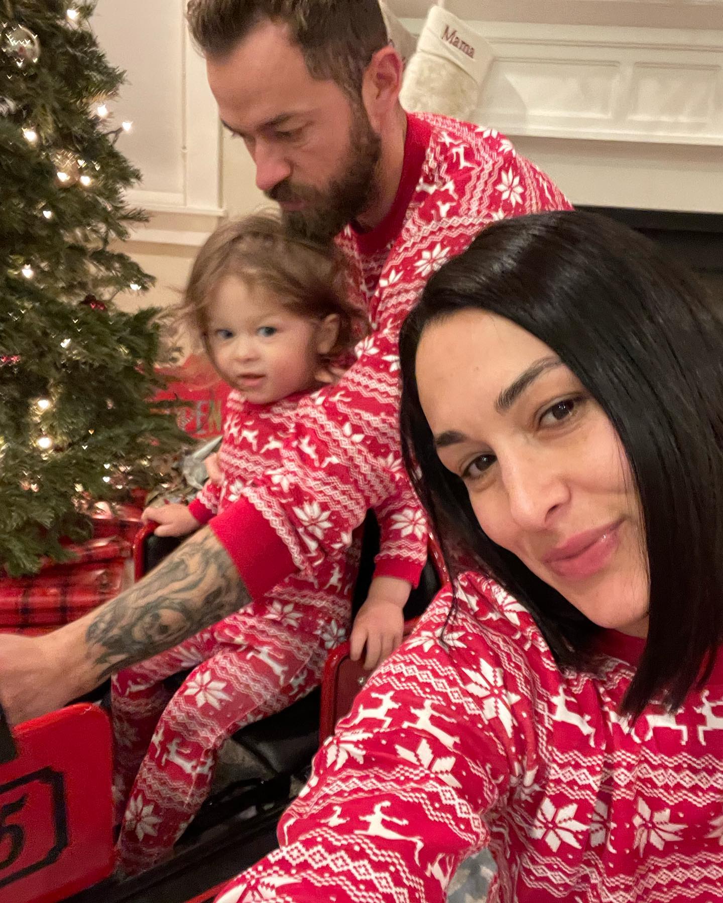 Nikki Garcia and Artem Chigvintsev with their son.