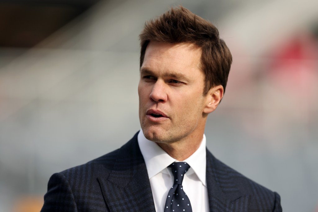 Tom Brady wears a suit.