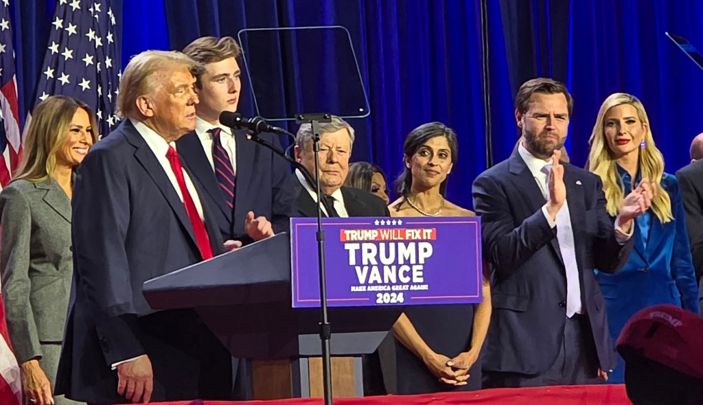 Donald Trump, Melania Trump, Baron Trump, Viktor Knavs, Usha Vance, J.D. Vance, Ivanka Trump, on stage.