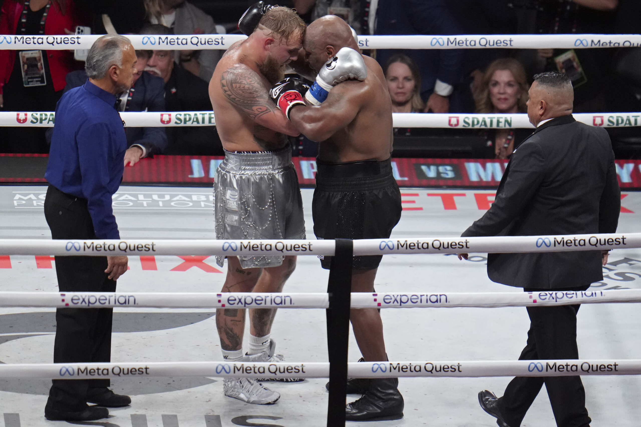 Jake Paul and Mike Tyson fighting.