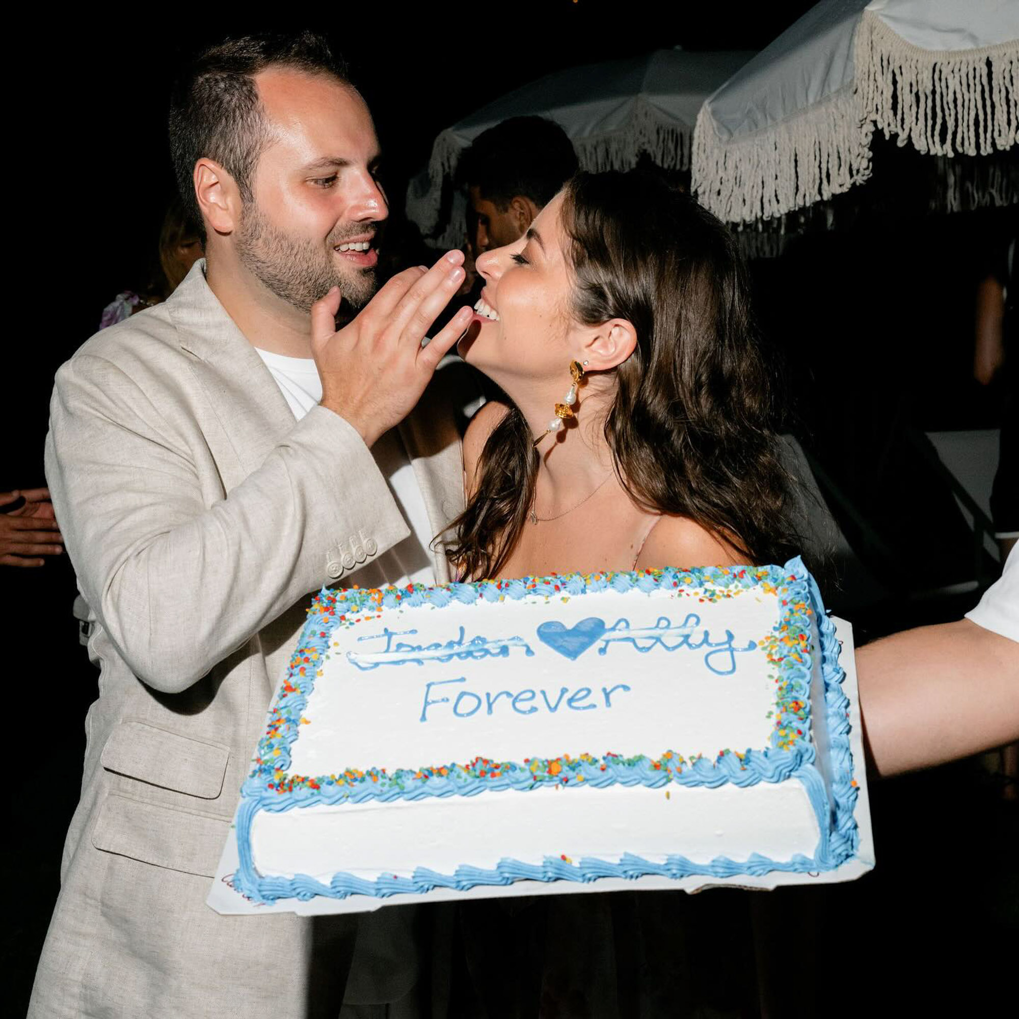 Ally Shapiro and Jordan Bilfeld eating cake