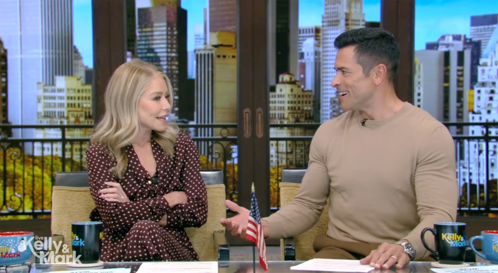 Kelly Ripa and Mark Consuelos talking