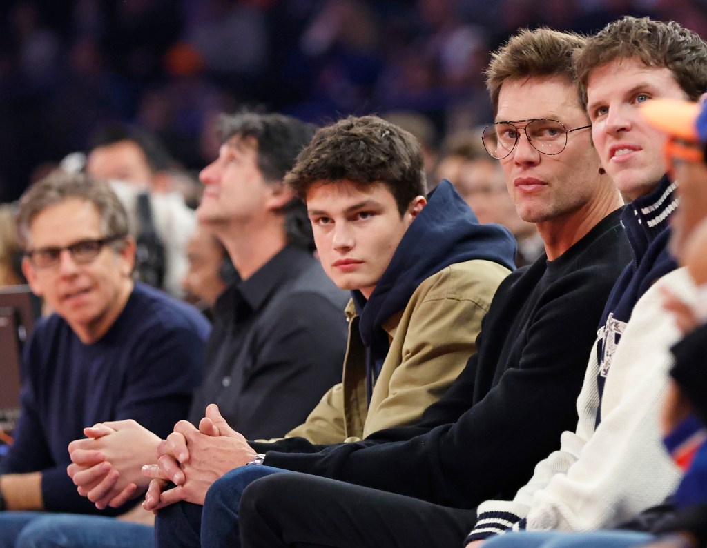 Tom Brady and Jack sit court side during the third quarter between the New York Knicks and the Brooklyn Nets at Madison Square Garden.