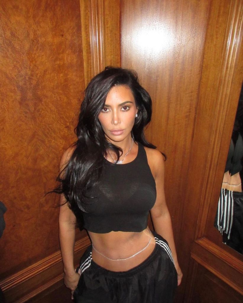 Kim Kardashian in a belly shirt.