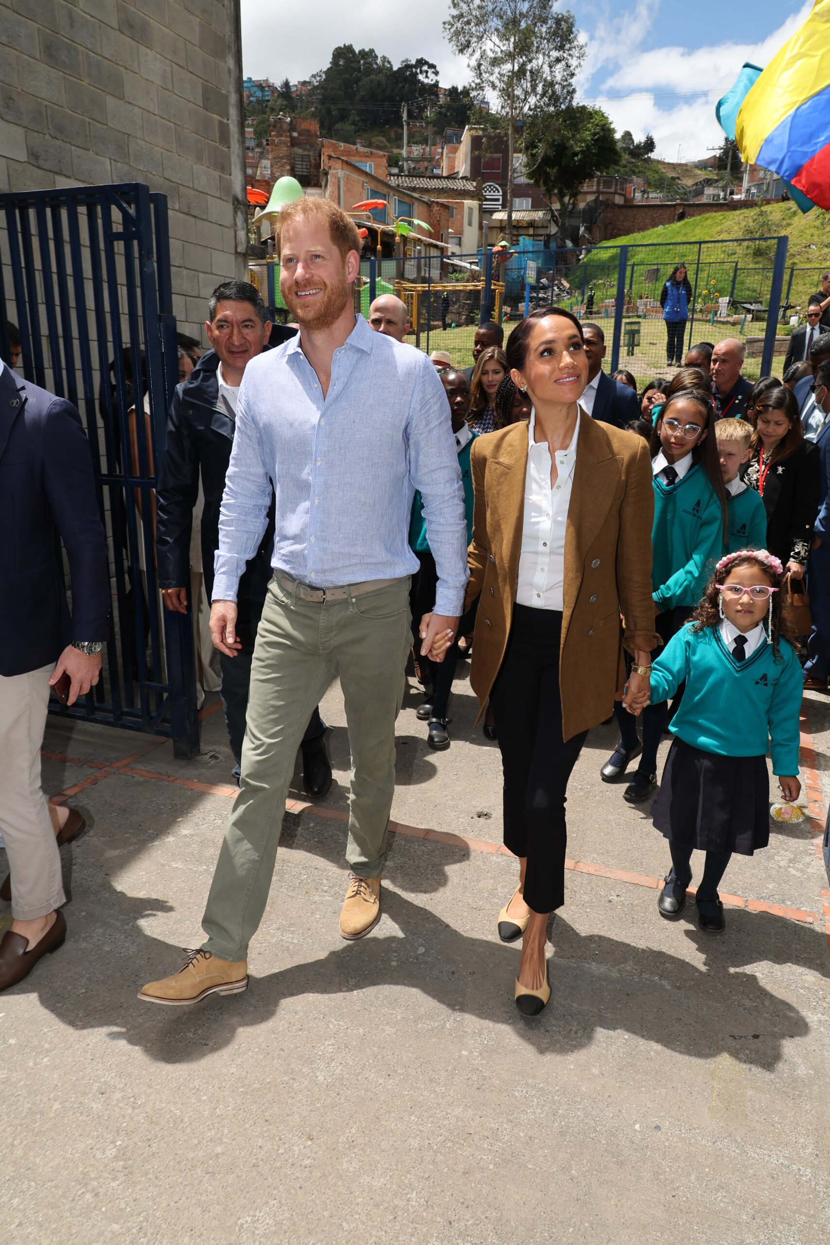 Prince Harry and Meghan Markle holding hands