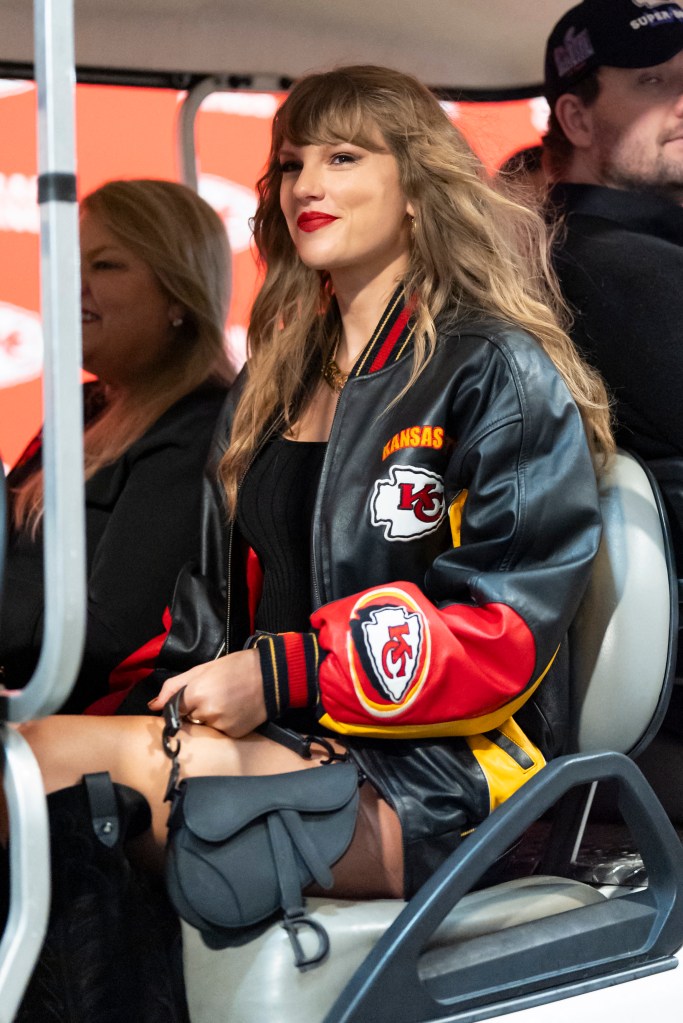 Taylor Swift rides a golf cart at the Kansas City Chiefs game on Monday night.