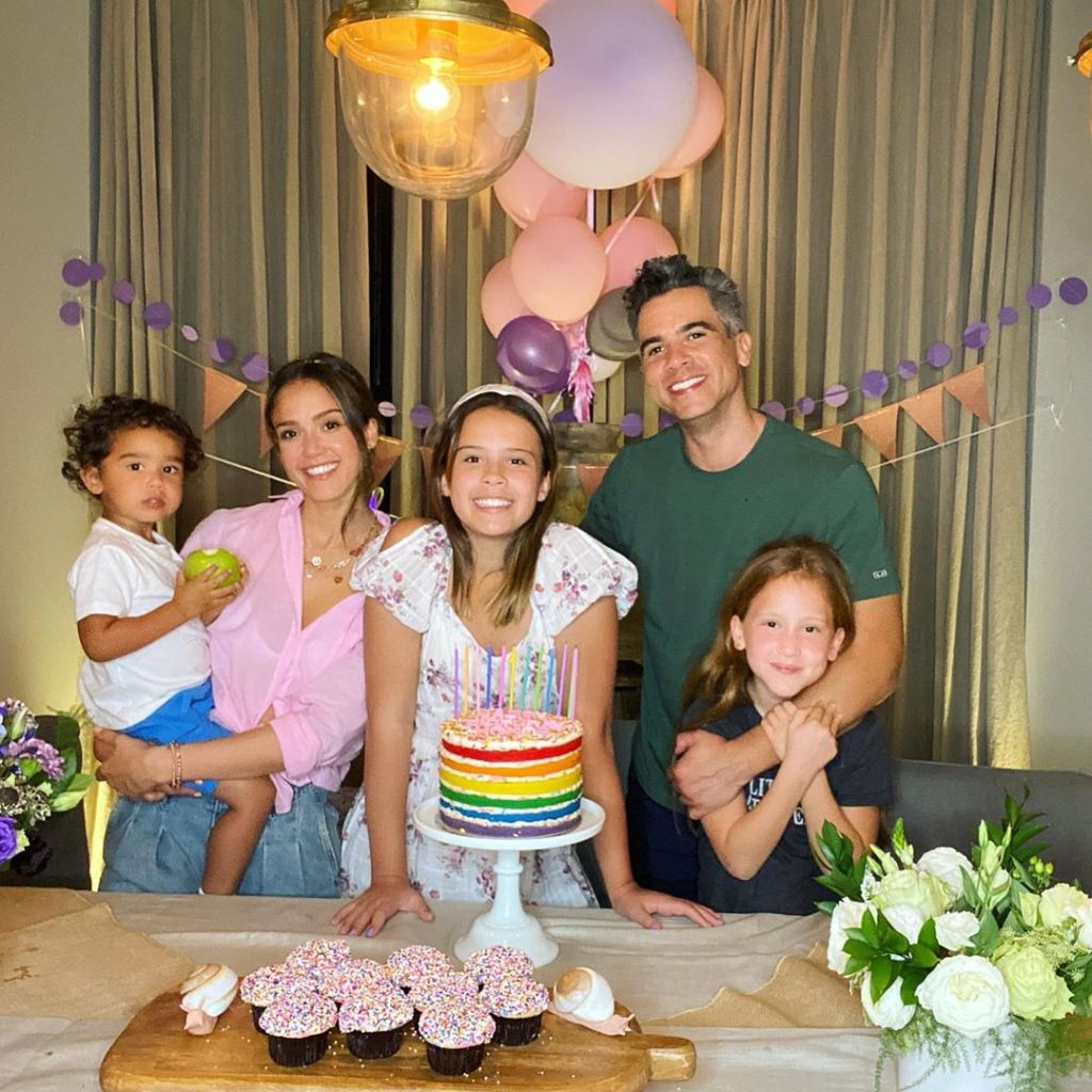 Jessica Alba posing with her family.