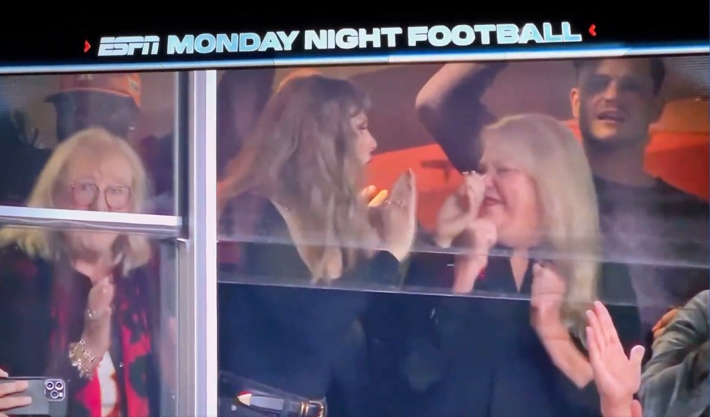 Taylor Swift gets fired up celebrating the Kansas City Chiefs' touchdown with mom Andrea on Monday.