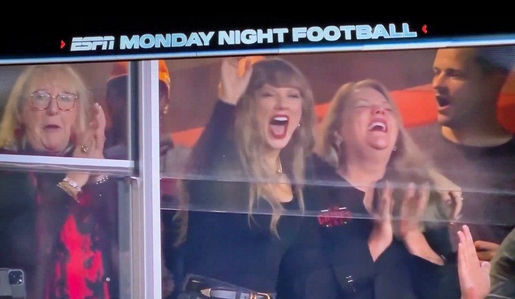 Taylor Swift gets fired up celebrating the Kansas City Chiefs' touchdown with mom Andrea on Monday.