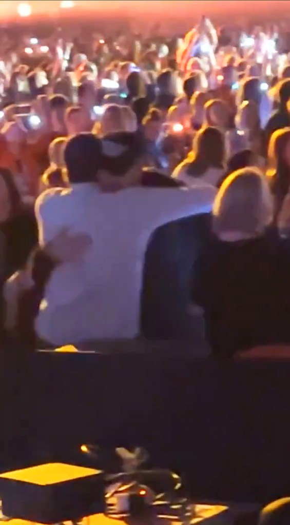 Travis Kelce hugging Austin Swift