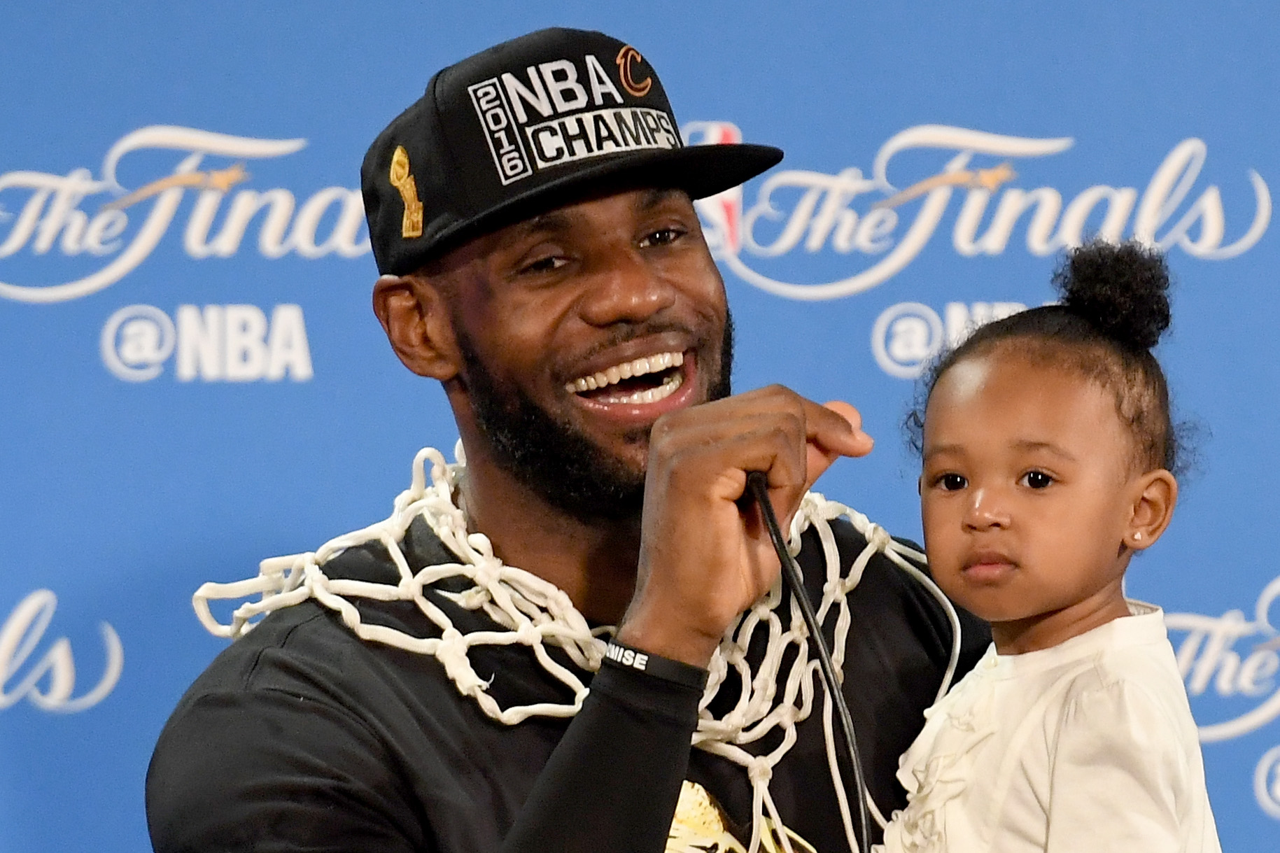 LeBron James holding his daughter