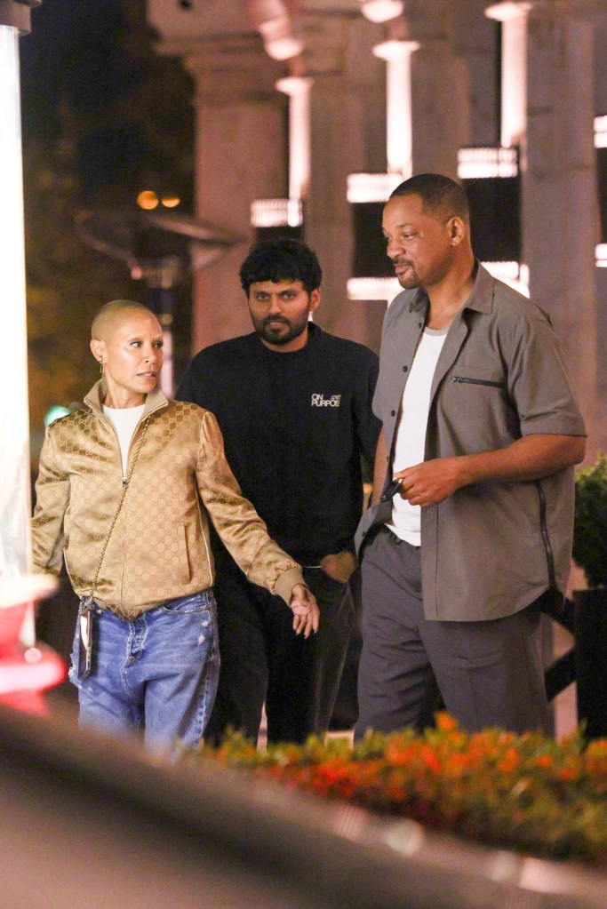 Will Smith and Jada Pinkett Smith talk while leaving dinner in Los Angeles.