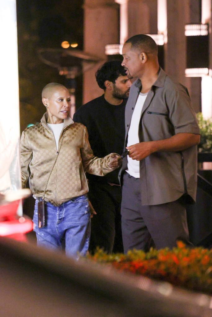 Will Smith and Jada Pinkett Smith talk while leaving dinner in Los Angeles.