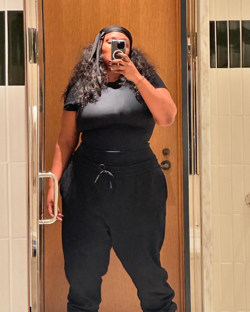 Lizzo poses in a mirror selfie.