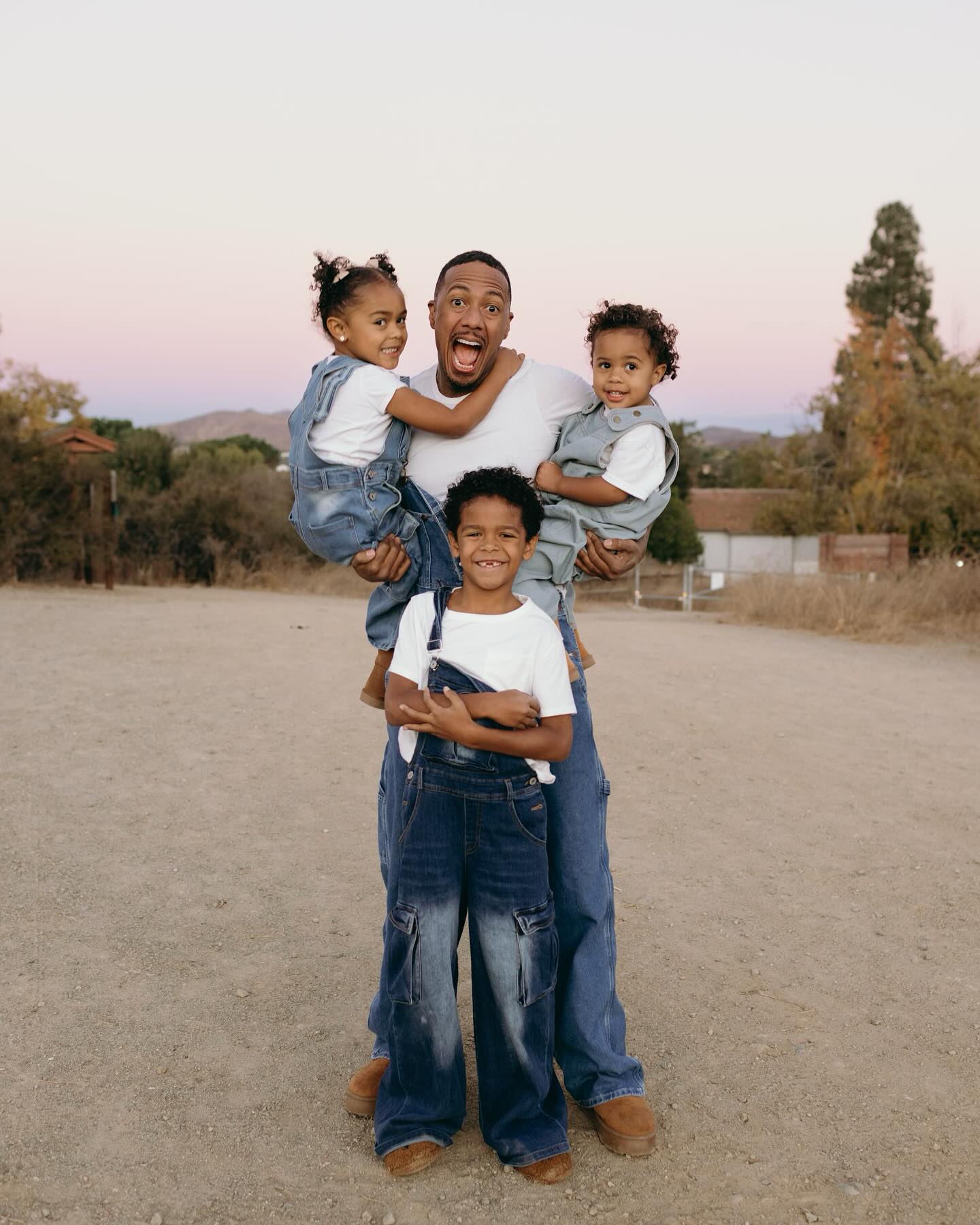 Nick Cannon poses for a photo with his kids on Thanksgiving.