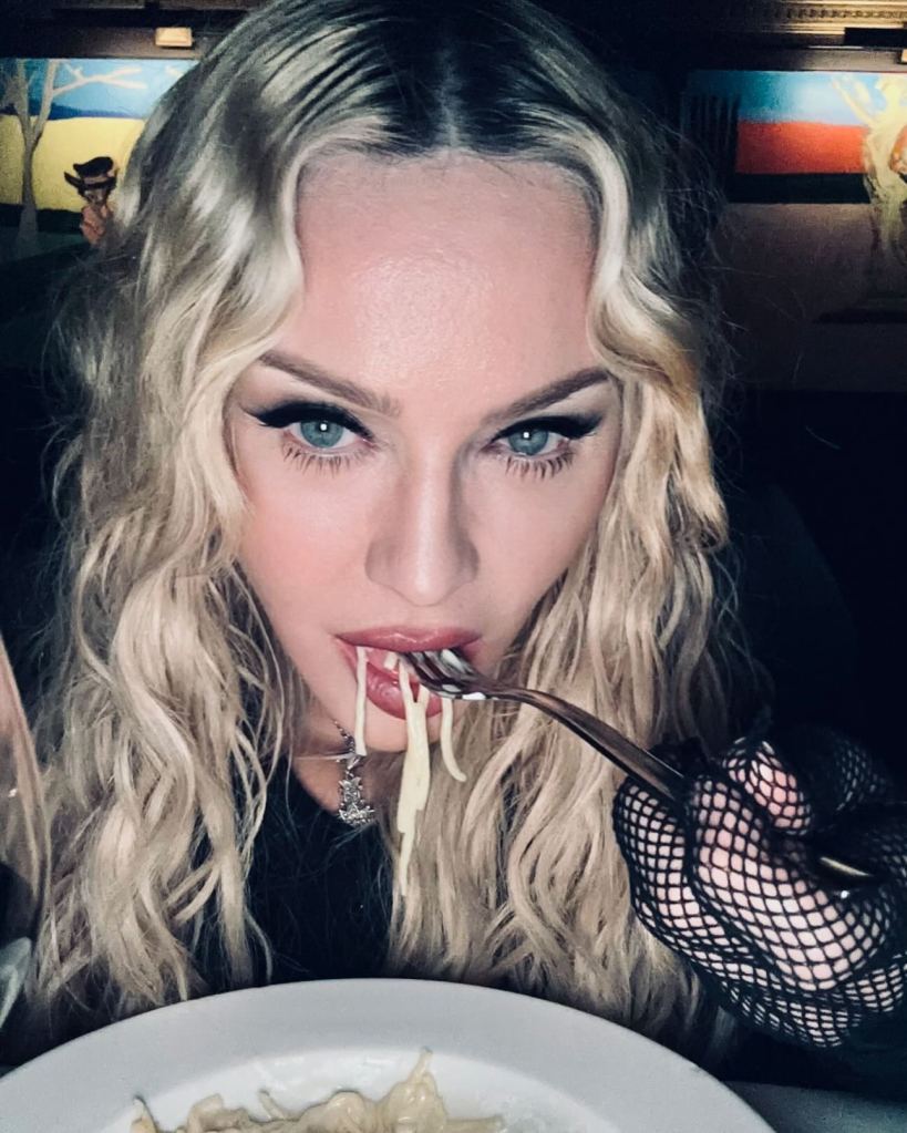 Madonna eating pasta