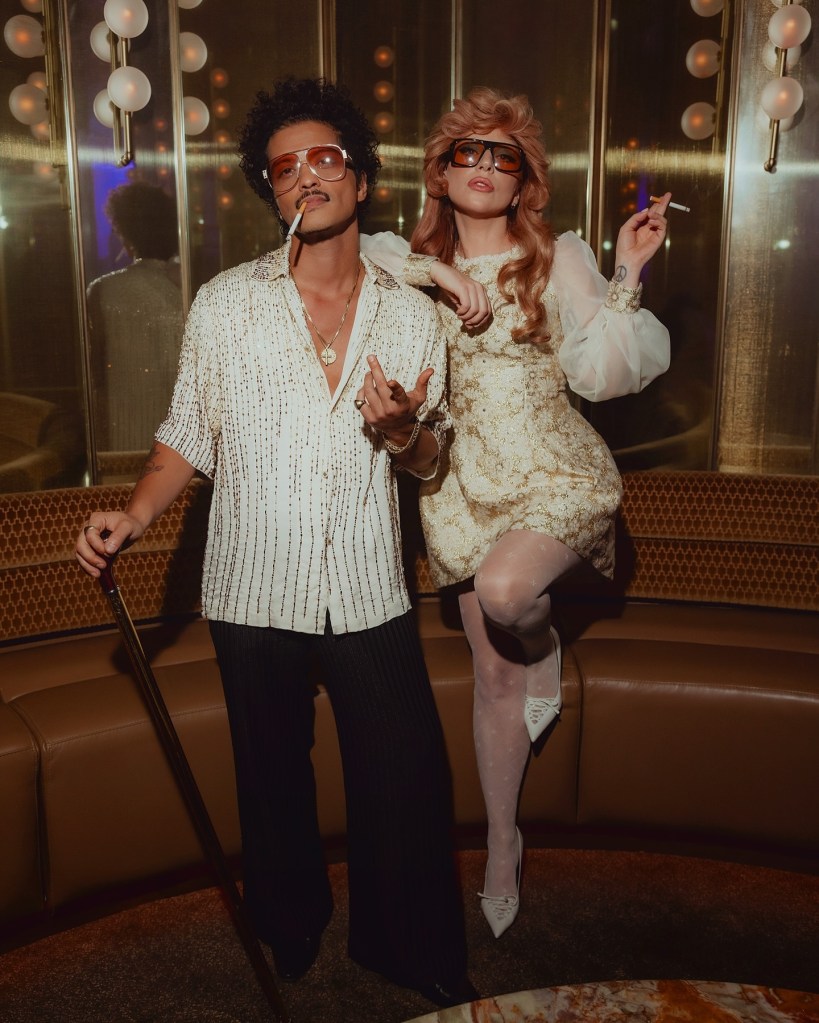 Bruno Mars and Lady Gaga pose together.