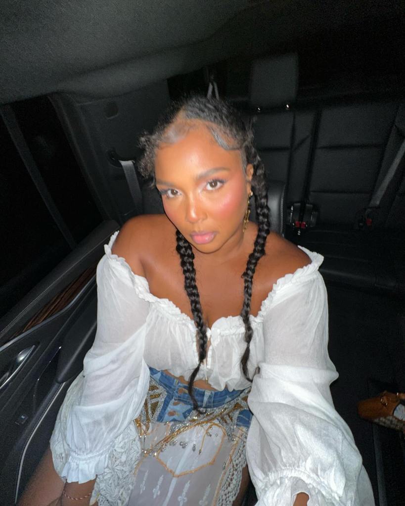 Lizzo poses in the car while with her mom on Friday.