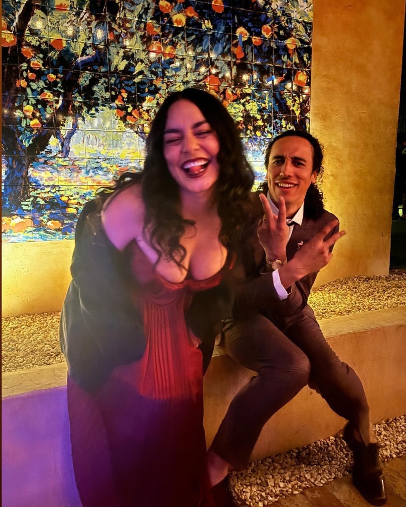 Vanessa Hudgens and a man, presumably Cole Tucker, posing for a picture