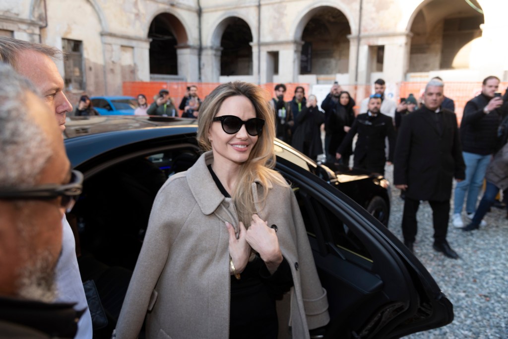 Angelina Jolie in sunglasses and a coat arriving at the 42nd Turin Film Festival in Italy