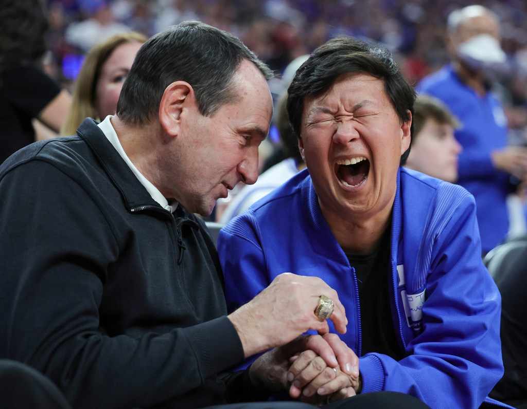 Former Duke Blue Devils head coach Mike Krzyzewski and actor Ken Jeong talking at the Vegas Showdown basketball game