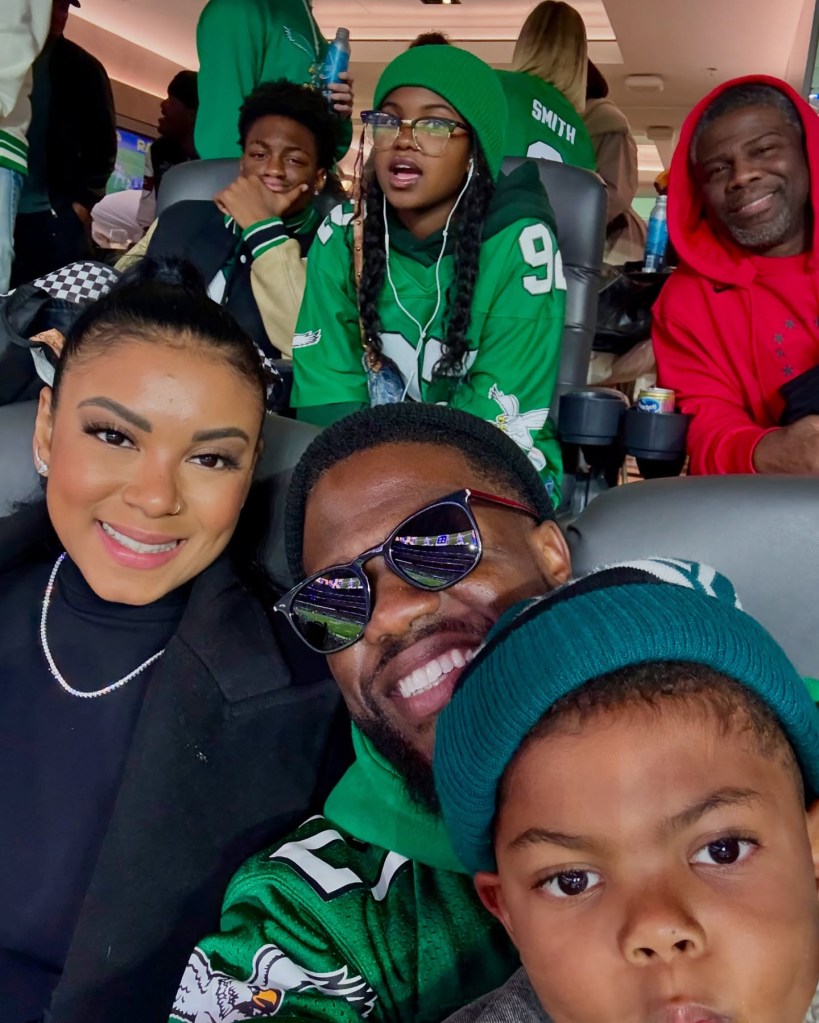 Kevin Hart and family posing for a photo, with a humorous reference to a mini slider.