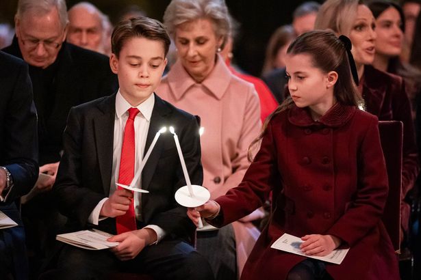 Charlotte and George light candles