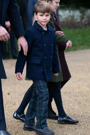 Prince Louis in his tartan trousers at Sandringham today