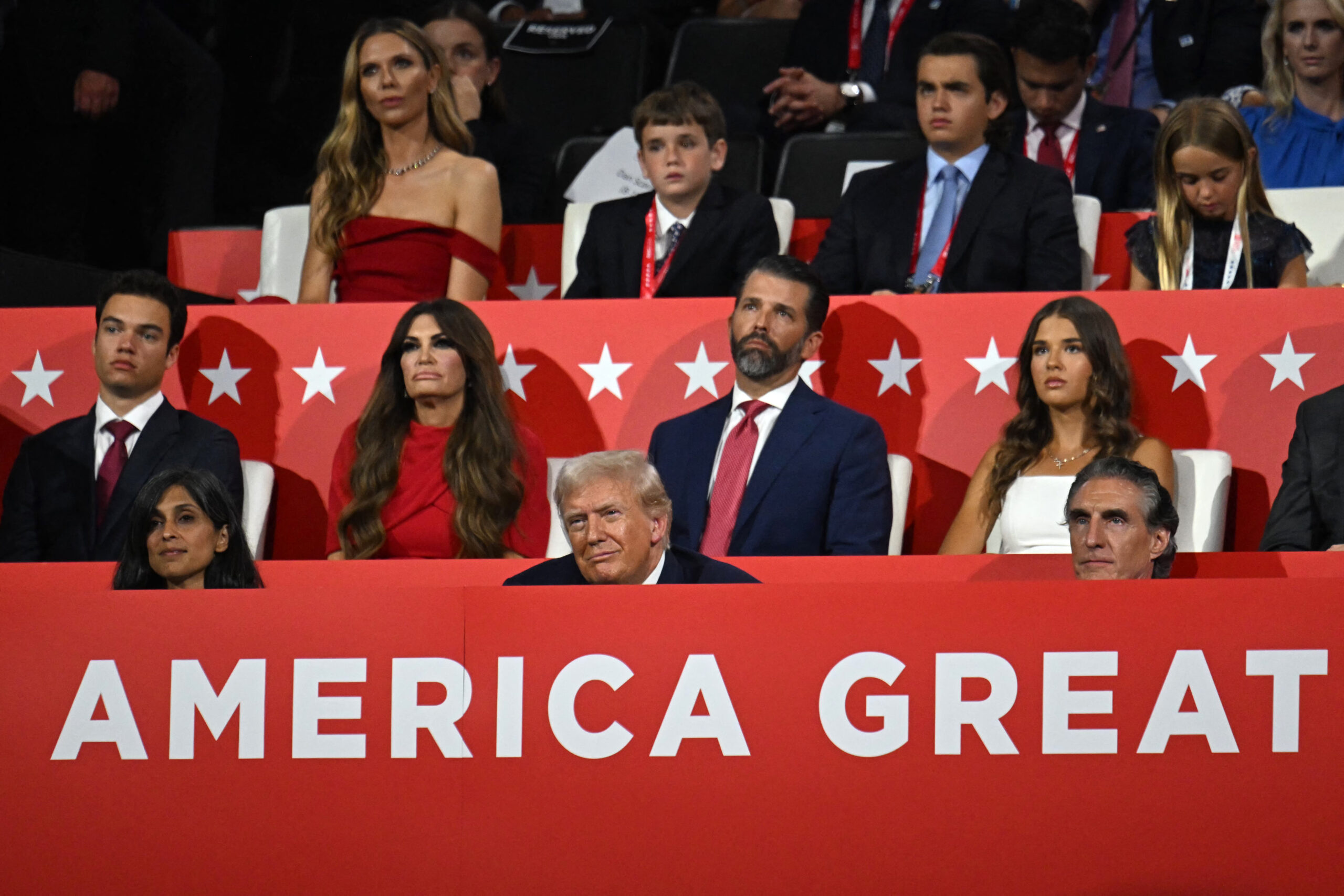 Bettina Anderson behind Trump Jr. and Guilfoyle at Republican Convention