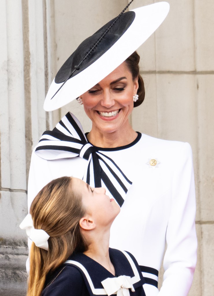 Princess Charlotte looks at her mother, Kate Middleton.