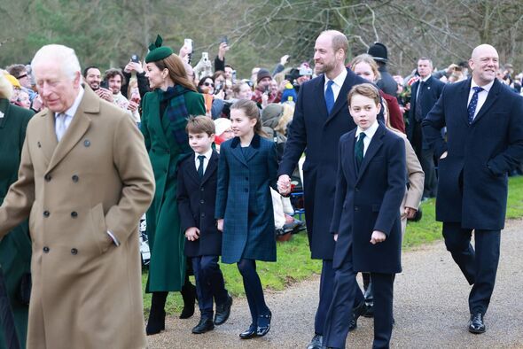 Prince George walks alongside his parents and his siblings on their way to church