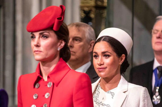 Catherine, The Duchess of Cambridge stands with Meghan, Duchess of Sussex at Westminster Abbey for a Commonwealth day service on March 11, 2019